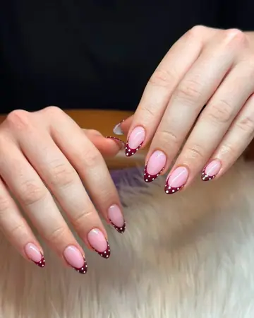 Short French tip nails with red cherry and dot art