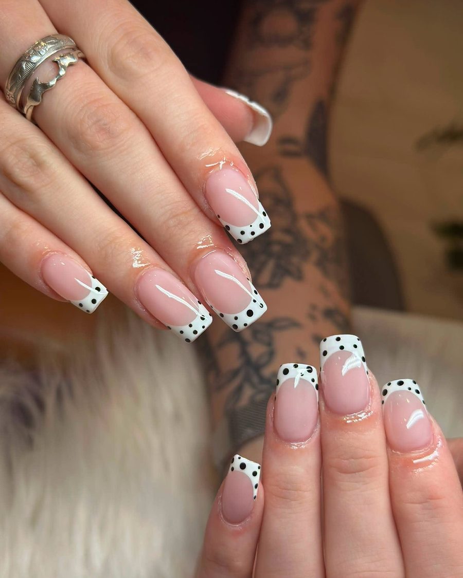 Nude almond French with black polka-dot tips