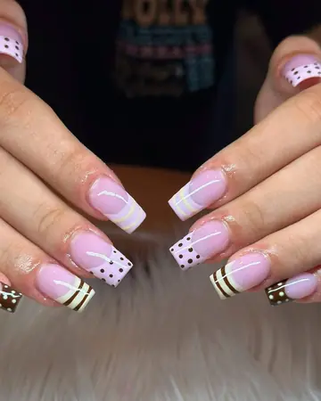 Pink coffin French nails with black dots and gold stripe accents