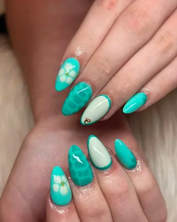 Teal green almond nails with white floral accents