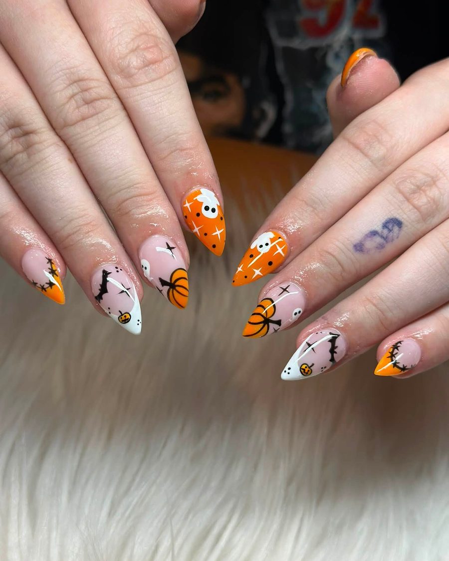 Orange and black Halloween French tips on almond nails