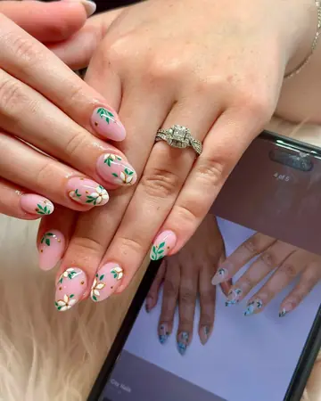 Short nude almond nails with green leaf and floral art
