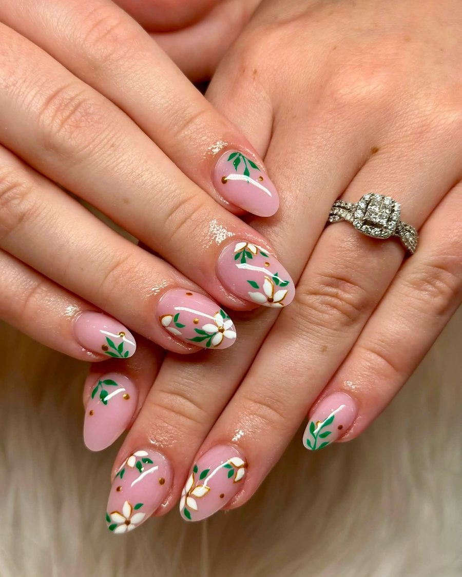 Nude almond nails with olive branch leaf art and glitter