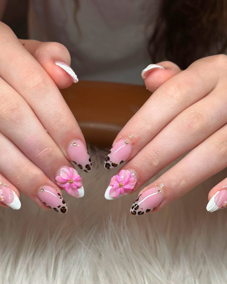 French tip nails with pink flower and leopard print accents