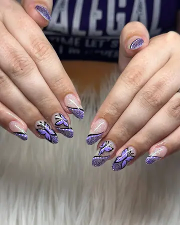 Purple butterfly nail art on almond acrylic nails