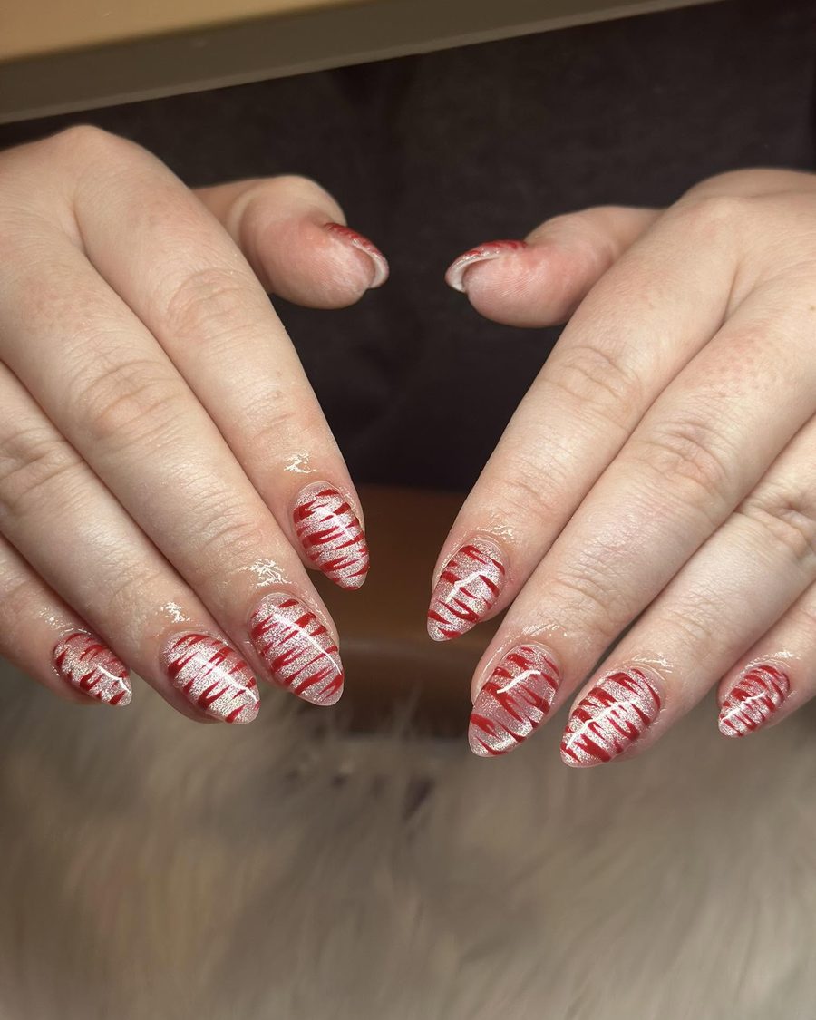 Nude nails with red candy stripe art