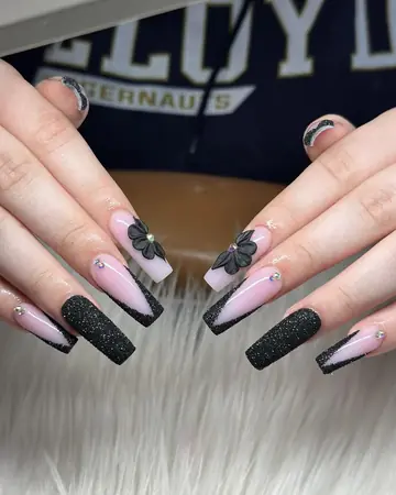Black glitter and nude coffin nails with floral accents