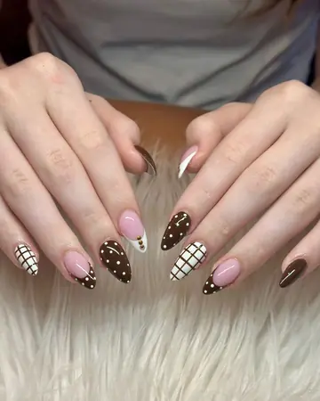 Chocolate brown and pink almond nails with polka dots and plaid